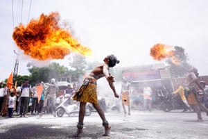 Participants perform a fire-breathing stunts