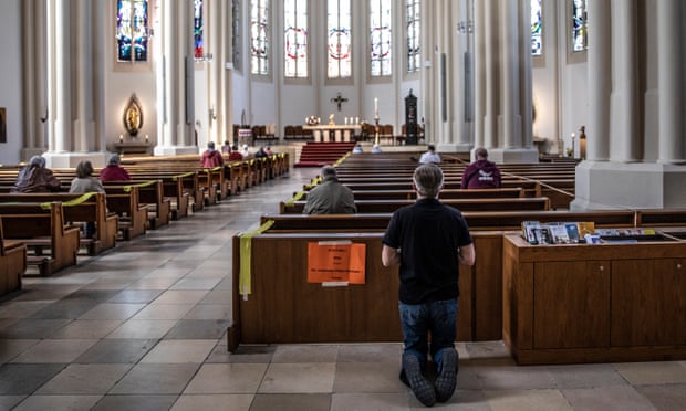 Worshippers pray on Easter Sunday at St Matthias Catholic church in Berlin.
