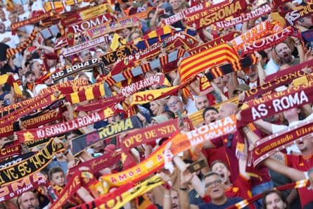 Roma supporters hold up scarves during their match against Inter.