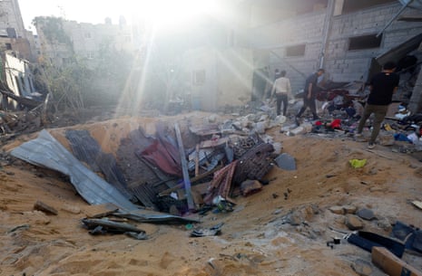 Palestinians inspect the site of an Israeli strike on a house in Rafah, in the southern Gaza Strip, on Wednesday.