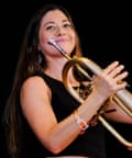 Woman holds flugelhorn