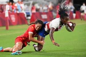 France’s Seraphine Okemba goes over to score a try despite the efforts of China’s Wang Wanyu.