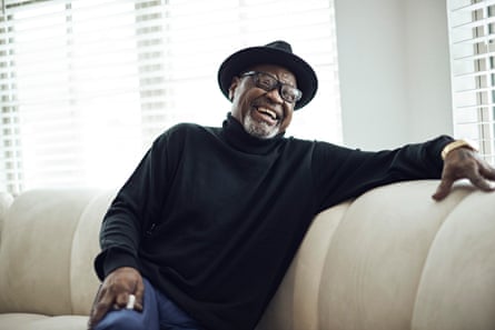 Glynn Simmons, who served 48 years in a US prison for a murder he didn’t commit, sitting on a couch and laughing heartily