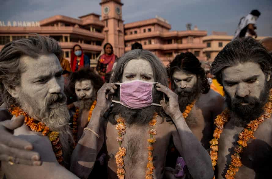 Agency photographer of the year – 2021 shortlist | World news 28 A Naga Sadhu, or Hindu holy man wears a mask before the procession for taking a dip in the Ganges river during Shahi Snan at Kumbh Mela Festival, in Haridwar, India, 12 April