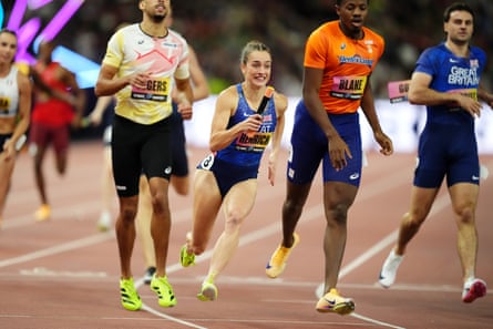 Charlotte Henrich (centre) competes in the mixed 4x400m relay final