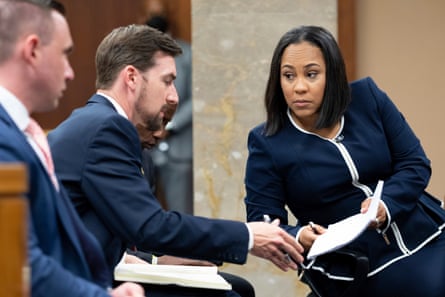 Fani Willis talks with her team during proceedings to seat a special purpose grand jury in Fulton county, Georgia, on 2 May 2022.