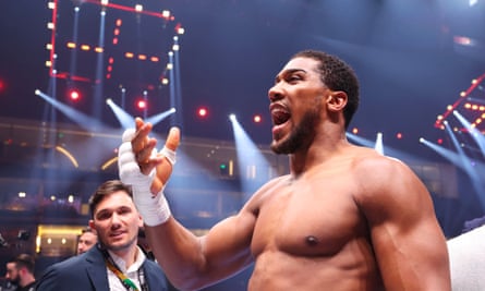 Anthony Joshua celebrates victory in the heavyweight fight against Francis Ngannou at the Kingdom Arena in Riyadh, Saudi Arabia.