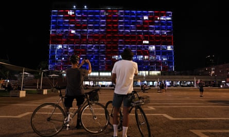 The Tel Aviv municipality building is illuminated with the colours of the union jack.