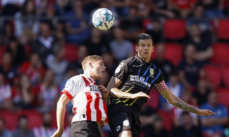 Joey Veerman of PSV Eindhoven with Michiel Kramer or RKC Waalwijk both attempting to head the ball during the Dutch Eredivisie match between PSV Eindhoven and RKC Waalwijk in September 2022.