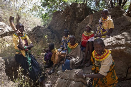 Former cutters from the Pokot tribe sit in Karamoja in Uganda.