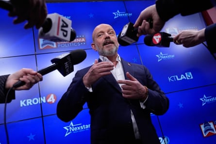 a man in front of microphones