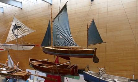 Small boats suspended from ceiling