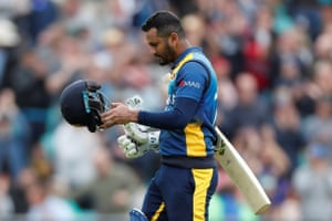 Dimuth Karunaratne looks dejected as he walks off after being caught.