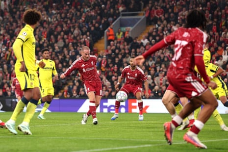 Alexis Mac Allister of Liverpool strikes the ball to score during a match at Anfield
