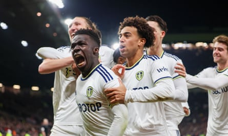 Leeds players celebrate going 2-0 up against Manchester United at Old Trafford.