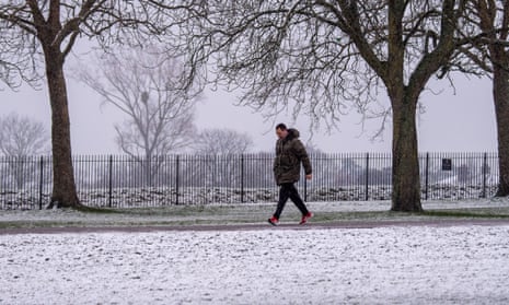Walkers and joggers were out at first light on the Long Walk in Windsor after overnight snow. The snow began to turn to sleet just after first light this morning.