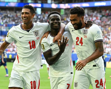 Bukayo Saka (centre) celebrates with Jude Bellingham and Reece James after scoring his third goal and England’s fifth.