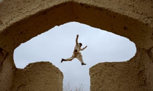 An Afghan boy plays in the ruins of a house that once belonged to the 13th-century Persian poet Rumi, on the outskirts of Mazar-i-Sharif.