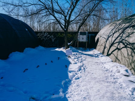 Snow on the ground and the outside of large tents