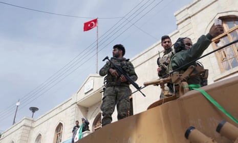 Turkish forces and Free Syrian Army troops in Afrin on Sunday.