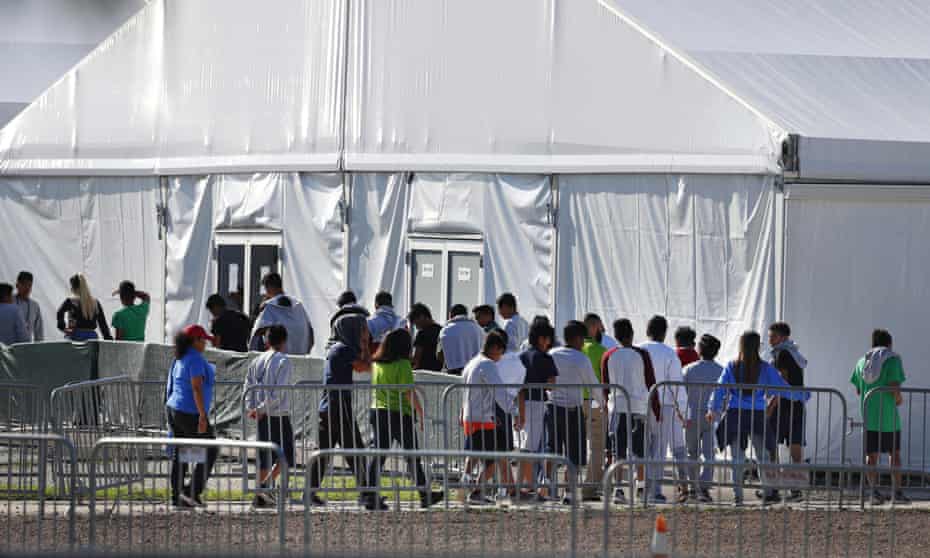Children line up to enter a tent at the Homestead shelter for unaccompanied children in Homestead, Florida in February 2019.
