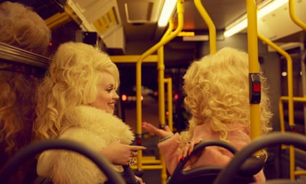 Dolly Parton lookalikes Alice Hawkins with Trixie Malicious on a night bus, London, 2019.