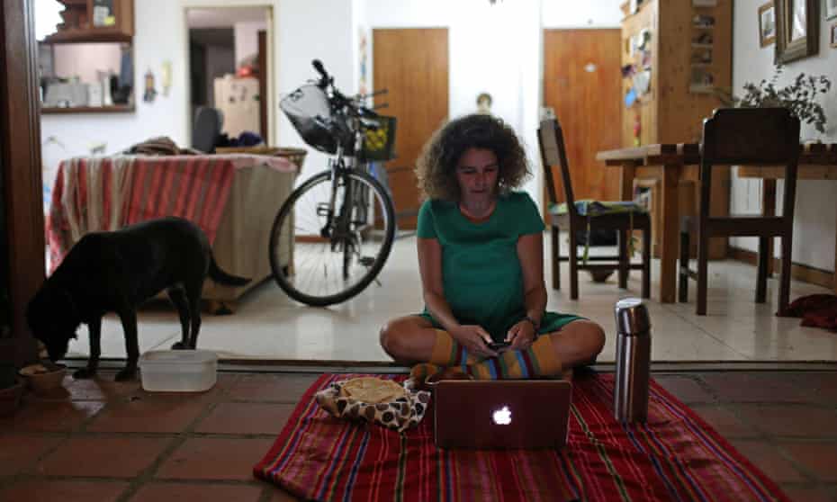 Ana Pereira of Caracas, Venezuela, joins a virtual picnic with her friends at home.