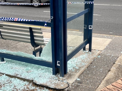 Shattered glass at a bus stop