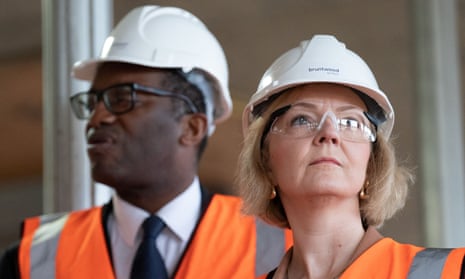Liz Truss and her chancellor, Kwasi Kwarteng, on a visit to a construction site during the Conservative party conference.