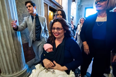 Senator Tammy Duckworth, 50, arrives at the Senate with her 10-day-old daughter Maile.