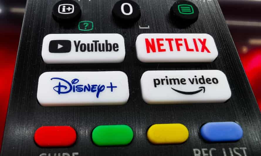 a TV controller with buttons featuring streaming companies' logos