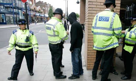 police performing a stop and search in harrow, north-west london