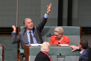 John Alexander looks like he is demonstrating how to serve a tennis ball during a division in the House of Representatives this evening, Monday 18th April 2016.