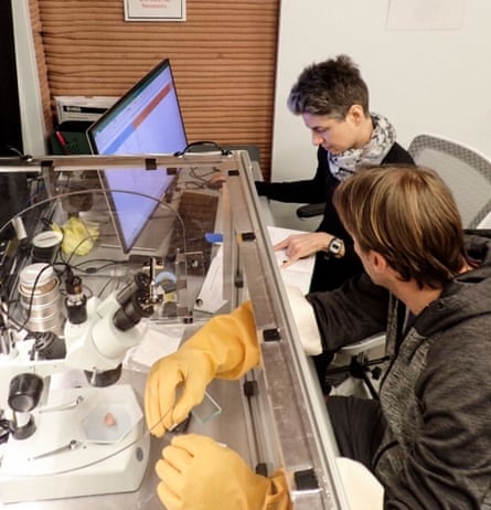 Anca Selariu, top, works with a colleague on a computer during a mission in Mars Dune Alpha