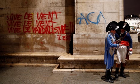 Graffiti is seen on the wall at the Arc de Triomphe