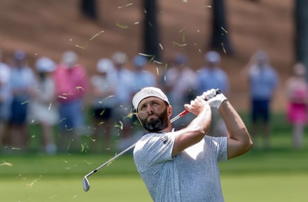 Jon Rahm of Spain hits from the rough on the 2nd.