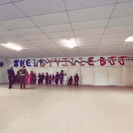 a group of children stand on a wall