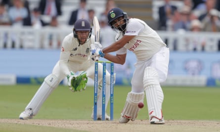 Mohammed Shami launches a shot off Moeen Ali during his unbeaten 56.