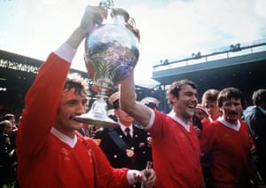 Kennedy holds aloft the First Division trophy with Terry McDermott in 1977