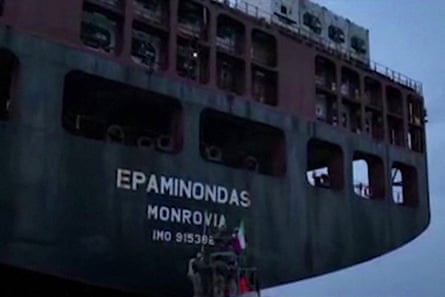Iranian forces prepare to board a large shipping container