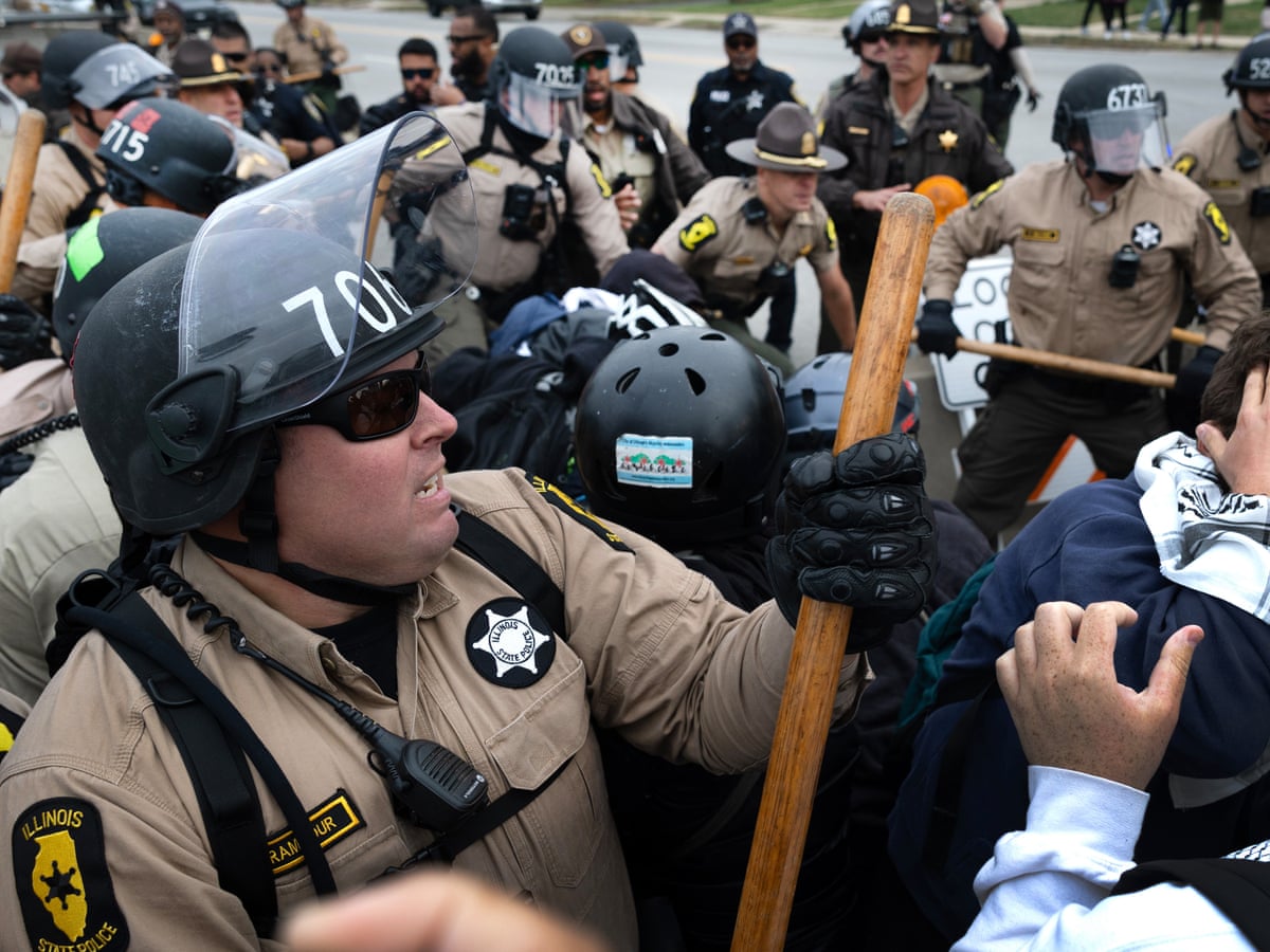 Chicago TV journalist pushed to ground and arrested during Ice raid, then later released | Chicago | The Guardian