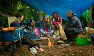 'People are friendly, but there's a palpable, eve-of-battle tension': protestors gather round the camp fire.