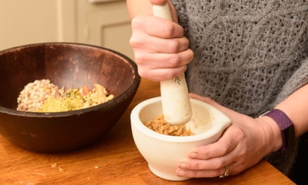 Using a pestle and mortar