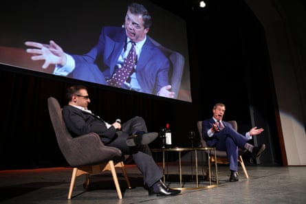 Nigel Farage on stage with publisher Damien Costa in 2018