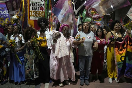 Women and candidates for the next general election protest against domestic violence, rape culture and femicide during the March of Flowers in Rio de Janeiro on 21 September