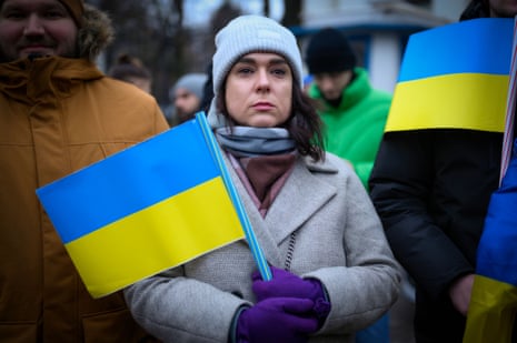 A woman holds the Ukrainian flag in Warsaw, Poland.