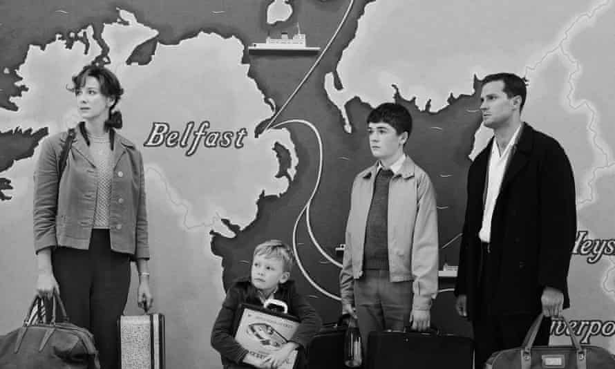 Caitriona Balfe as Ma, Jude Hill as Buddy, Lewis McAskie as Will, and Jamie Dornan as Pa in director Kenneth Branagh’s BELFAST