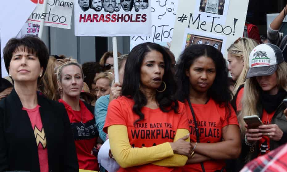 Demonstrators participate in a #MeToo march In Los Angeles.