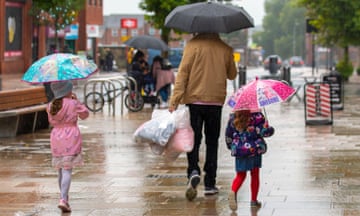 Shoppers in Preston in the rain