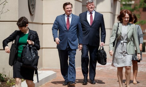 The former Trump campaign manager Paul Manafort, centre left, and his lawyer Kevin Downing leave the US district court in Alexandria, Virginia, on Friday.